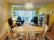 Bright dining area with wood floors and a table for four at 105 Island Way # 121, Clearwater Beach, FL 33767