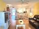 Open living area with dining space and kitchen view at 105 Island Way # 121, Clearwater Beach, FL 33767