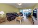 Spacious living room with leather furniture and hardwood floors at 105 Island Way # 121, Clearwater Beach, FL 33767