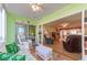 Bright porch with view into living room and patio access at 105 Island Way # 121, Clearwater Beach, FL 33767