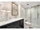 Modern bathroom featuring marble walls, sleek vanity, and glass-enclosed shower, offering a luxurious feel at 855 Bayway Blvd # 101, Clearwater, FL 33767