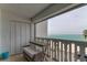 Charming balcony with a table, seating, and serene ocean views at 403 Gulf Way # 504, St Pete Beach, FL 33706