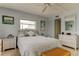 Comfortable bedroom with tile floors, white wicker furnishings, and soft, neutral tones for a relaxing atmosphere at 403 Gulf Way # 504, St Pete Beach, FL 33706