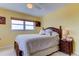 Comfortable bedroom with wicker bed, tropical decor, and light-colored tiled floor at 403 Gulf Way # 504, St Pete Beach, FL 33706
