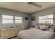 Bright bedroom featuring tile floors, two windows with ocean views, and soft, neutral tones for a relaxing atmosphere at 403 Gulf Way # 504, St Pete Beach, FL 33706