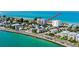 Exterior shot of a beachfront community with colorful homes, and stunning ocean views at 403 Gulf Way # 504, St Pete Beach, FL 33706