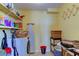 Practical laundry area featuring a washing machine, storage shelves, and organization at 403 Gulf Way # 504, St Pete Beach, FL 33706