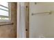 Tiled shower with handrails and a shower curtain at 403 Gulf Way # 504, St Pete Beach, FL 33706
