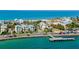 Waterfront homes near a pier showcasing beautiful ocean views and coastal charm at 403 Gulf Way # 504, St Pete Beach, FL 33706