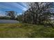 Fenced backyard with mature trees and green grass at 12821 Bergstrom Bay Dr, Riverview, FL 33579