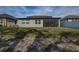 Spacious backyard with screened patio and grassy area at 12821 Bergstrom Bay Dr, Riverview, FL 33579