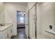 Bathroom with a shower, vanity, and view of bedroom at 12821 Bergstrom Bay Dr, Riverview, FL 33579