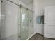 Bathroom with walk-in shower, built-in seat, and modern fixtures at 12821 Bergstrom Bay Dr, Riverview, FL 33579