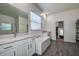 Spa-like bathroom with double vanity, soaking tub, and walk-in shower at 12821 Bergstrom Bay Dr, Riverview, FL 33579