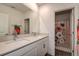 ' bathroom with double vanity and floral shower curtain at 12821 Bergstrom Bay Dr, Riverview, FL 33579