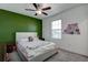 Bedroom with a full-size bed and an accent wall at 12821 Bergstrom Bay Dr, Riverview, FL 33579