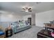 Spacious bonus room with plenty of natural light and a comfy couch at 12821 Bergstrom Bay Dr, Riverview, FL 33579