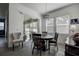 Bright dining area with round table and chairs, near sliding doors leading to the backyard at 12821 Bergstrom Bay Dr, Riverview, FL 33579