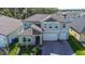 Two-story home with two-car garage and landscaped yard at 12821 Bergstrom Bay Dr, Riverview, FL 33579