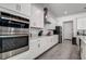 Modern kitchen with stainless steel appliances and white cabinetry at 12821 Bergstrom Bay Dr, Riverview, FL 33579