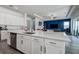 Large kitchen island with white cabinets and a breakfast bar area at 12821 Bergstrom Bay Dr, Riverview, FL 33579