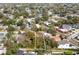 Aerial view of a residential lot in a suburban neighborhood, featuring mature trees and well-maintained streets at 1002 W Charter St, Tampa, FL 33602