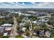Aerial view of a residential lot with nearby houses and a river, surrounded by lush greenery at 1002 W Charter St, Tampa, FL 33602