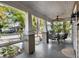 Inviting front porch with ceiling fan and seating area at 103 E Jean St, Tampa, FL 33604