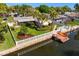 Aerial view of house, dock, and canal with lush landscaping at 5269 Dover Ne St, St Petersburg, FL 33703