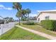 Brick-paved walkway leads through a lush, grassy backyard at 5269 Dover Ne St, St Petersburg, FL 33703