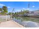 View of canal with boat lift and neighboring homes at 5269 Dover Ne St, St Petersburg, FL 33703