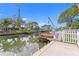 Concrete dock with boat lift and canal view at 5269 Dover Ne St, St Petersburg, FL 33703