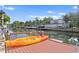 Orange kayak on a wooden dock by the canal at 5269 Dover Ne St, St Petersburg, FL 33703