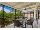 Relaxing screened porch with table and chairs at 5269 Dover Ne St, St Petersburg, FL 33703