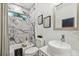 Modern bathroom with marble tile, a soaking tub, and updated fixtures at 5334 37Th N St, St Petersburg, FL 33714