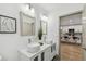 Elegant bathroom with double sinks, a view of the kitchen, and sleek design at 5334 37Th N St, St Petersburg, FL 33714