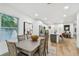 Light and bright dining room with a large table and six chairs at 5334 37Th N St, St Petersburg, FL 33714