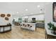 Modern kitchen featuring white and gray cabinets, quartz countertops, and stainless steel appliances at 5334 37Th N St, St Petersburg, FL 33714