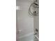 Simple bathroom with a clean white tiled shower and tub at 2101 Sunset Point Rd # 1302, Clearwater, FL 33765