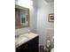 Well-lit bathroom featuring a vanity with dark cabinets at 2101 Sunset Point Rd # 1302, Clearwater, FL 33765