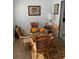 Bright breakfast nook with wicker chairs and a round table at 2101 Sunset Point Rd # 1302, Clearwater, FL 33765