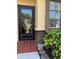 Front entry with a glass storm door at 2101 Sunset Point Rd # 1302, Clearwater, FL 33765