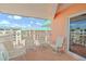 Condo balcony with patio furniture and ocean view at 18400 E Gulf Blvd # Ph-11, Indian Shores, FL 33785