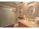 Clean bathroom with a tub, shower, and updated vanity at 18400 E Gulf Blvd # Ph-11, Indian Shores, FL 33785