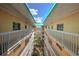 Condo building with interior courtyard and walkway at 18400 E Gulf Blvd # Ph-11, Indian Shores, FL 33785