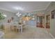 Dining room with table and chairs, view of kitchen pass-through at 18400 E Gulf Blvd # Ph-11, Indian Shores, FL 33785