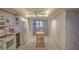 Kitchen with white cabinets and breakfast bar, looking toward dining area at 18400 E Gulf Blvd # Ph-11, Indian Shores, FL 33785