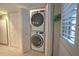 Convenient laundry closet with stacked washer and dryer at 18400 E Gulf Blvd # Ph-11, Indian Shores, FL 33785