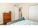 Bedroom with double bed, dresser, and spacious closet at 357 S Mcmullen Booth Rd # 120, Clearwater, FL 33759