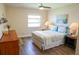 Bedroom with queen bed, wood dresser, and window at 357 S Mcmullen Booth Rd # 120, Clearwater, FL 33759